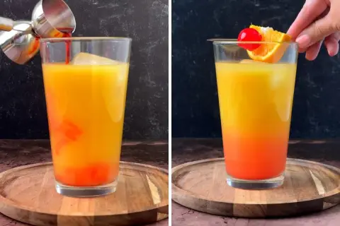 Un cóctel **tequila sunrise** con capas de naranja y rojo, decorado con una rodaja de naranja y una cereza.